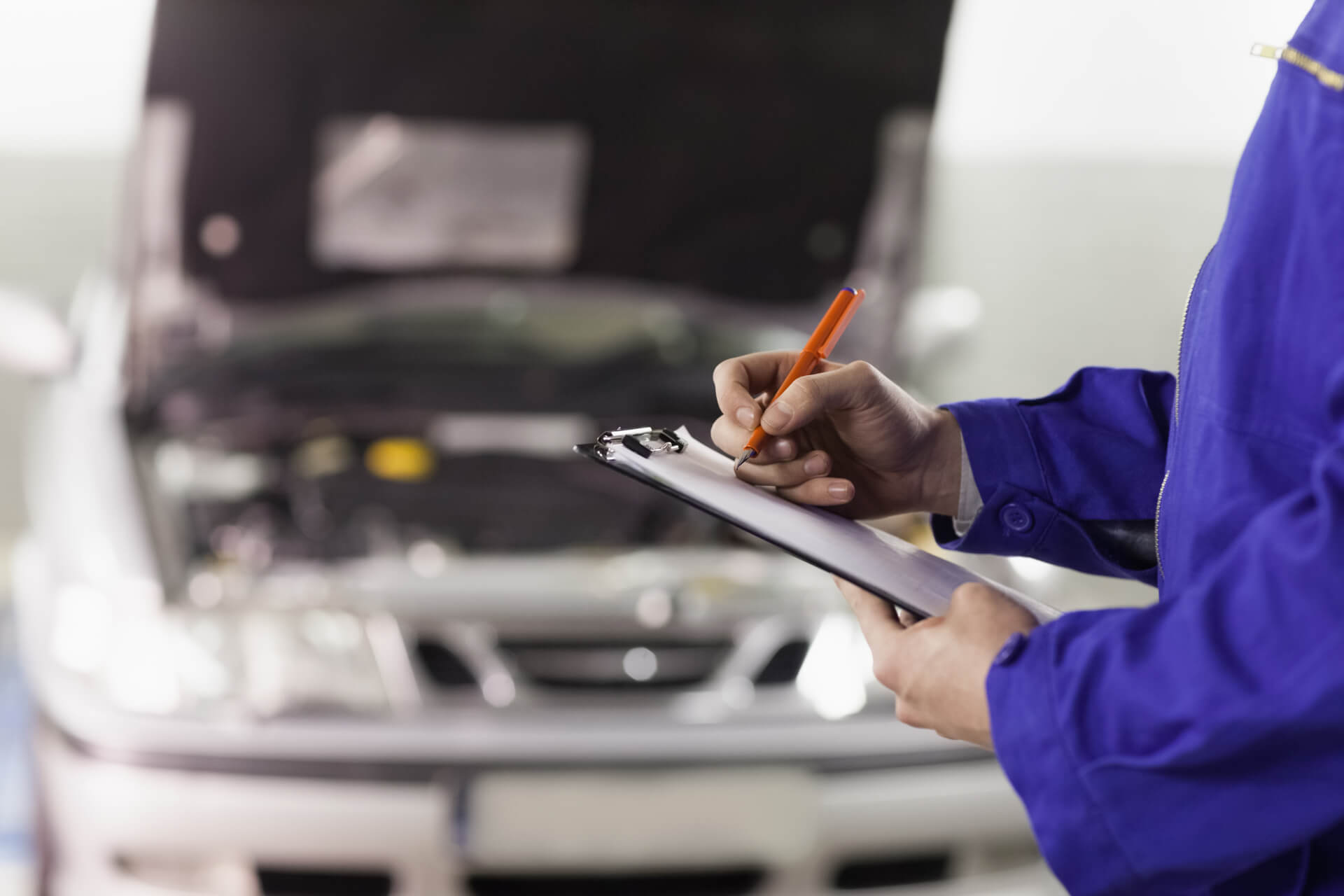 Mechanic In Texas Servicing A Car