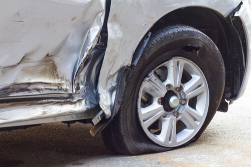 Passenger side flat tire after car accident